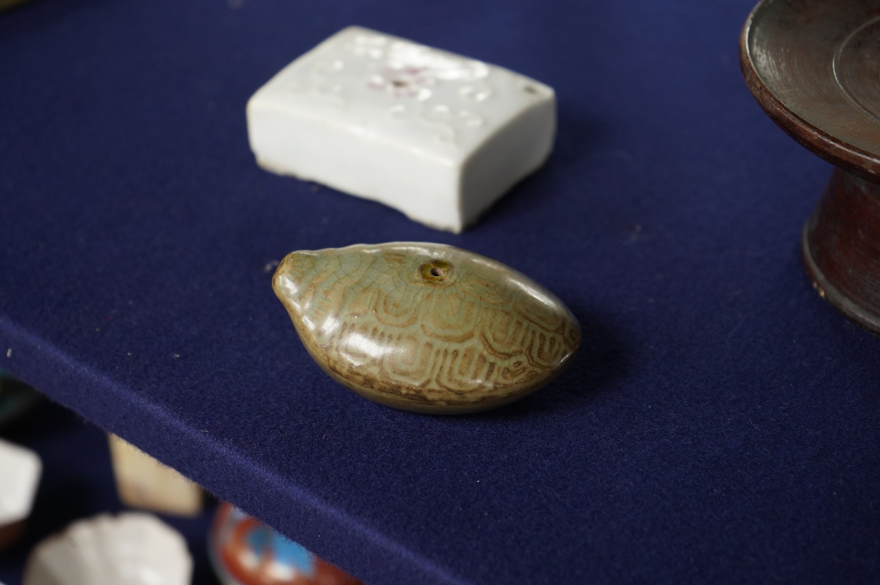 Two 19th century Korean ceramic water droppers and a Korean turned wood cup stand, oval water dropper 8cm long